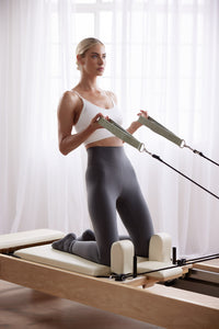 Woman stretching on PIYO Pilates Mat, Australia